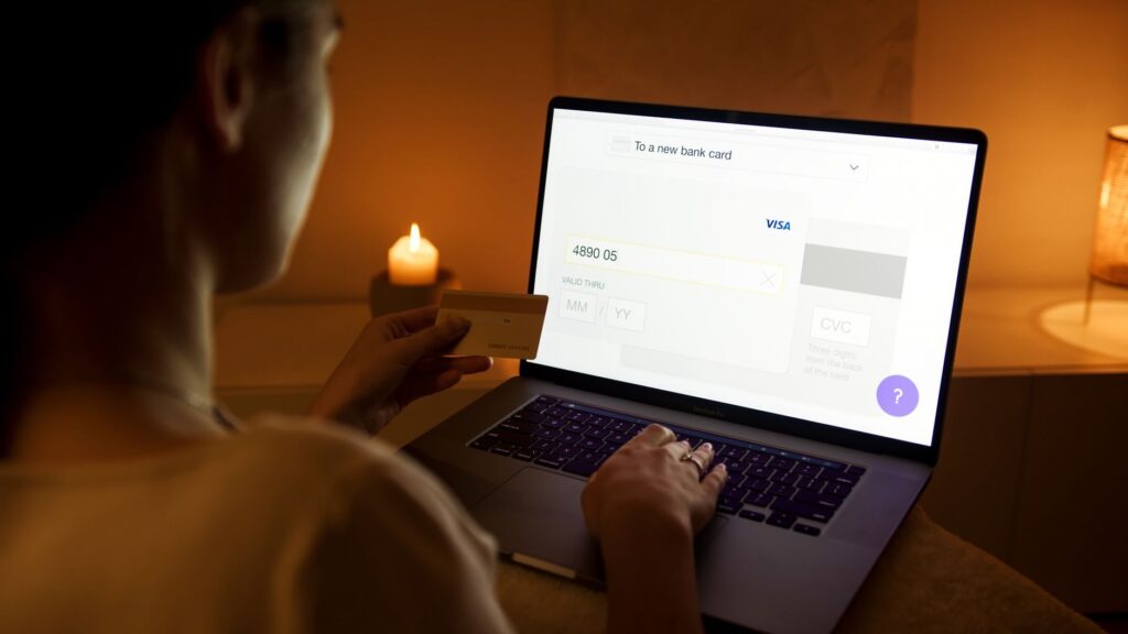 Tenant using laptop to make a secure online rent payment through the Envision resident portal